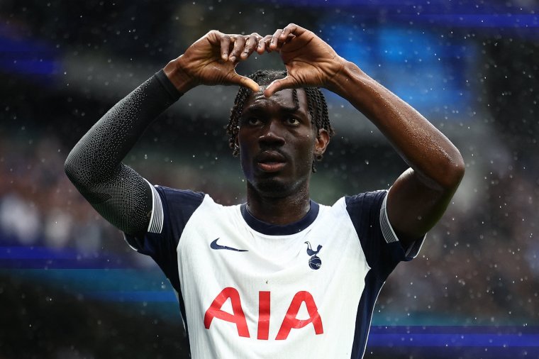 Tottenham Hotspur's Malian midfielder #08 Yves Bissouma celebrates scoring the opening goal during the English Premier League football match between Tottenham Hotspur and Everton at the Tottenham Hotspur Stadium in London, on August 24, 2024. (Photo by HENRY NICHOLLS / AFP) / RESTRICTED TO EDITORIAL USE. No use with unauthorized audio, video, data, fixture lists, club/league logos or 'live' services. Online in-match use limited to 120 images. An additional 40 images may be used in extra time. No video emulation. Social media in-match use limited to 120 images. An additional 40 images may be used in extra time. No use in betting publications, games or single club/league/player publications. / (Photo by HENRY NICHOLLS/AFP via Getty Images)