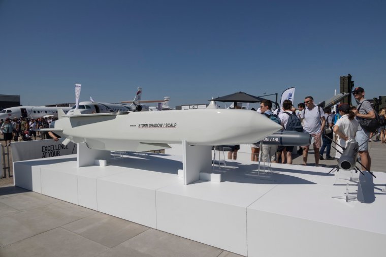 Visitors are gathered around a SCALP EG / STORM SHADOW low-observable, long-range air-launched cruise missile, an air to surface weapon from the European manufacturer MBDA at the company's booth at International Paris Air Show 2023 in Le Bourget Airport. The Long Range Autonomous Cruise Missile System carries a warhead with a unit cost around 2.500.000 USD. Next to the SCALP EG system are other like BRIMESTONE, SPEAR, SEA VENOM / ANL, AKERON LP. Paris, France on June 2023 (Photo by Nicolas Economou/NurPhoto via Getty Images)