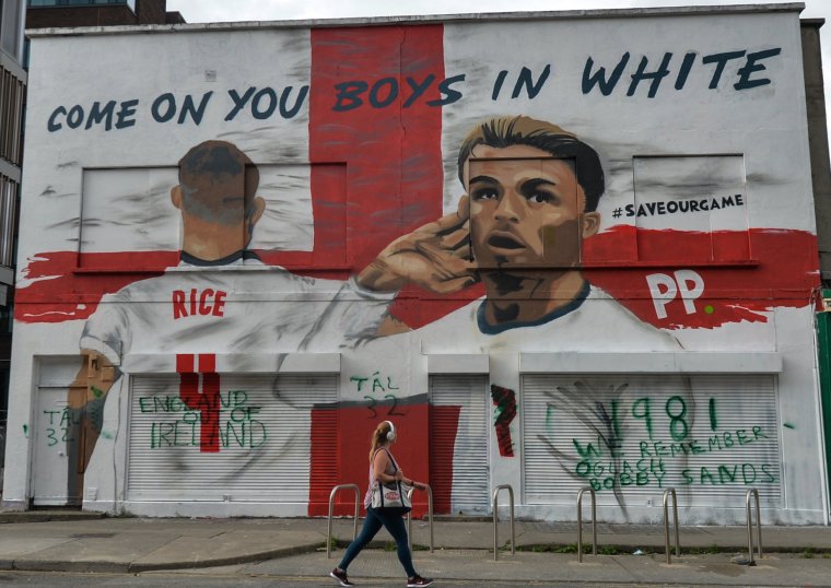 A mural featuring the English duo Jack Grealish and Declan Rice at Euro 2020 and the words 'Come On You Boys In White' has has appeared in the center of Dublin... and was already vandalised within hours of appearing. The duo abondoned their green jersey to play for England, after promising underage international appearances for Ireland. The mural was created in conjunction with artist Shane Ha and is part of Paddy Power's #SaveOurGame campaign. On Sunday, 13 June 2021, in Dublin, Ireland. (Photo by Artur Widak/NurPhoto via Getty Images)