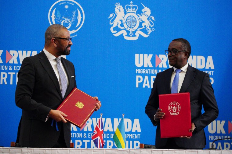 KIGALI, RWANDA - DECEMBER 5: British Home Secretary James Cleverly meeting Rwandan Minister of Foreign Affairs Vincent Biruta sign a new treaty with Rwanda on December 5, 2023 in Kigali, Rwanda. The treaty will address concerns by the Supreme Court, including assurances that Rwanda will not remove anybody transferred under the partnership to another country. (Photo by Ben Birchall - Pool/Getty Images)