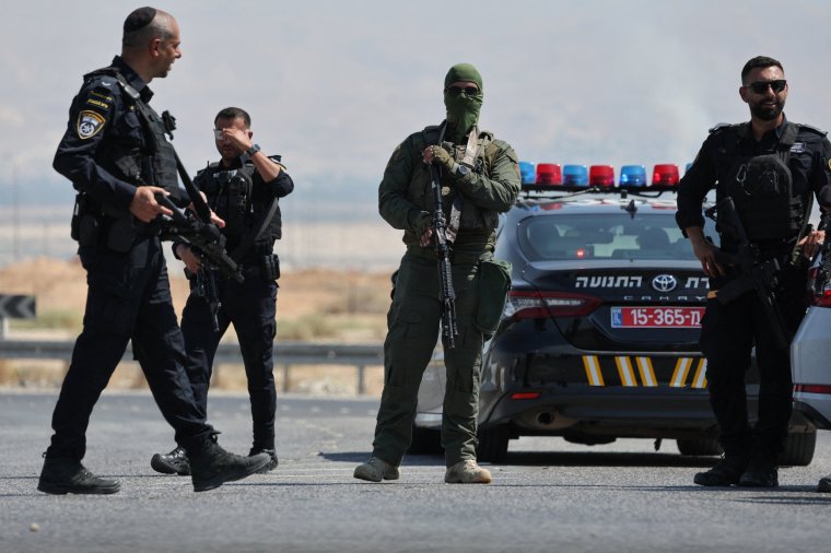 Israeli security forces gather at the scene of a reported attack near the Allenby Crossing between the occupied West Bank and Jordan on September 8, 2024, where the Israeli military said a truck driver opened fire, killing three Israelis. The (Photo by Ahmad GHARABLI / AFP) (Photo by AHMAD GHARABLI/AFP via Getty Images)