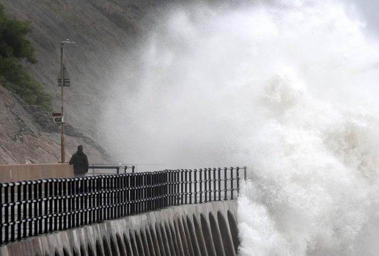 Waves crash over the promenade during wet and windy weather in Folkestone, Kent. Heavy rain is set to continue as two fresh weather warnings come into force on Monday, potentially bringing more flooding and travel disruption. Picture date: Monday September 30, 2024. PA Photo. See PA story WEATHER Rain. Photo credit should read: Gareth Fuller/PA Wire