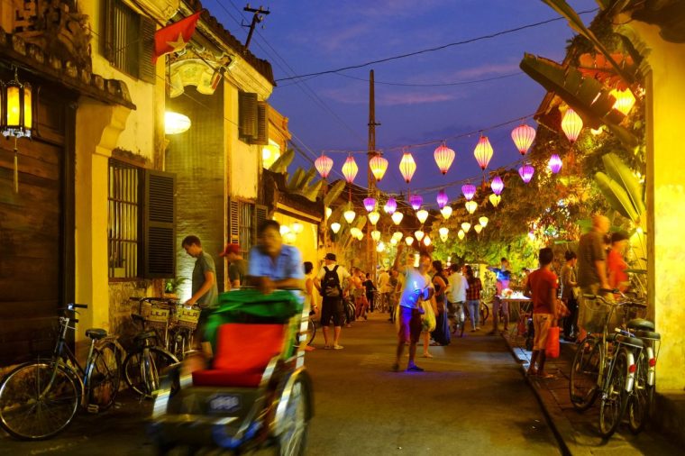 Locals and tourist in Tran Phu street at night, Hoi An, Vietnam