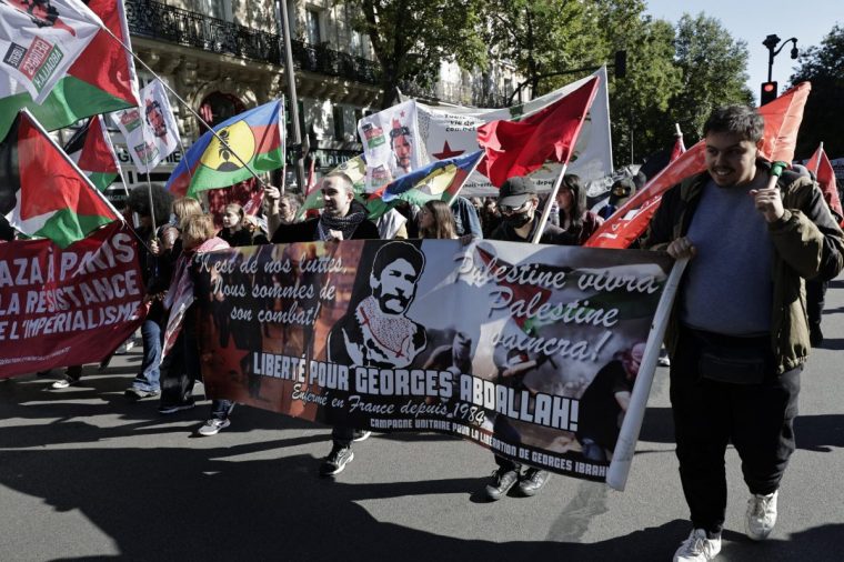 People take part in a rally ogarnised by the association France Palestine Solidarite (AFPS) in support of the Palestinian people, in Paris, on October 5, 2024. (Photo by STEPHANE DE SAKUTIN / AFP) (Photo by STEPHANE DE SAKUTIN/AFP via Getty Images)