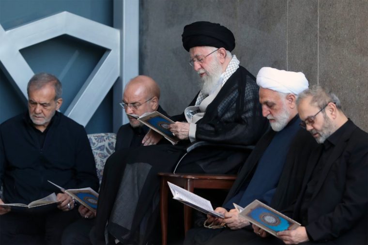 Iranian supreme leader Ali Khamenei, centre, sits alongside Hezbollah representative in Iran Abdallah Safieddine, far right, during the Friday prayer ceremony in Tehran on 4 October (Photo: Iranian Leader's Press Office / Getty Images)