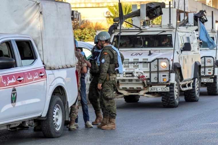 Spanish peacekeepers of the United Nations Interim Force in Lebanon (UNIFIL) coordinate their patrol with the Lebanese Military Police, in Marjayoun in south Lebanon on October 8, 2024. (Photo by AFP) (Photo by -/AFP via Getty Images)