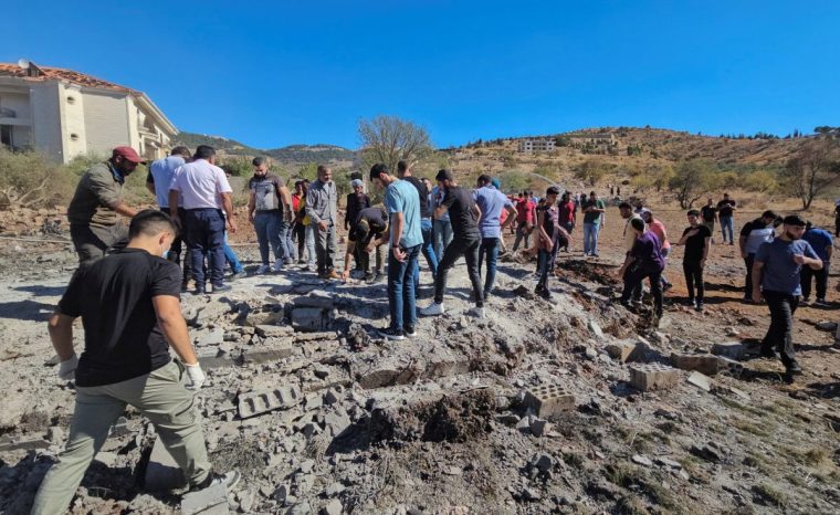 People inspect the site of an Israeli strike in the town of Baaloul, in the western Bekaa Valley, Lebanon October 19, 2024. REUTERS/Maher Abou Taleb