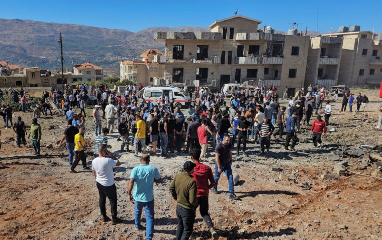 People and rescuers inspect the site of an Israeli strike in the town of Baaloul, in the western Bekaa Valley, Lebanon October 19, 2024. REUTERS/Maher Abou Taleb