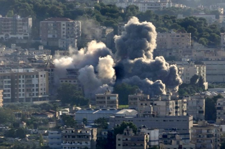 Smoke rises from Israeli airstrikes on Choueifat town, southern Beirut, Lebanon, Saturday, Oct. 19, 2024. (AP Photo/Hussein Malla)