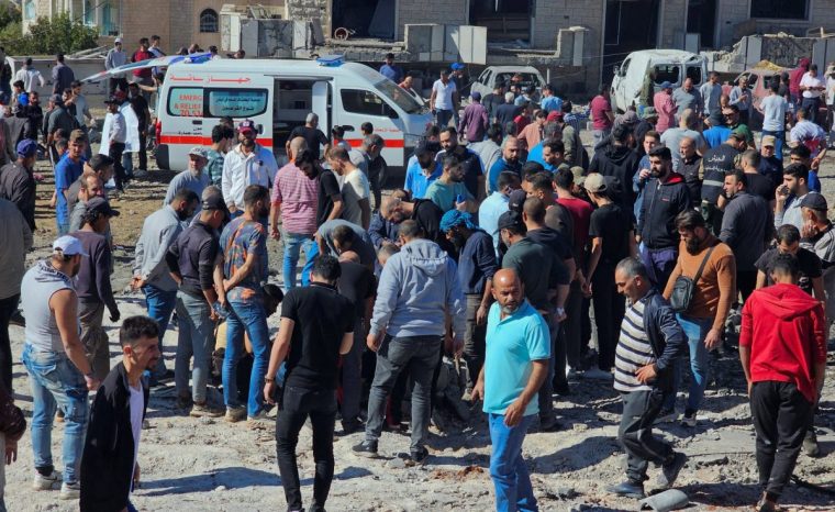 People and rescuers inspect the site of an Israeli strike in the town of Baaloul, in the western Bekaa Valley, Lebanon October 19, 2024. REUTERS/Maher Abou Taleb