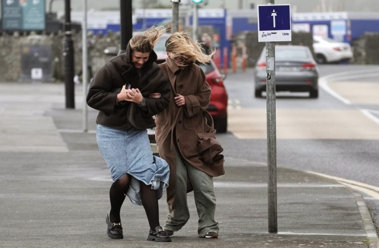 People struggle to walk in the wind on the promenade in Salthill, Galway, as a Met Eireann orange alert for Kerry, Leitrim, Sligo, Clare, Donegal, Mayo and Galway came into effect at 10am on Sunday and will be in place to 8pm as Storm Ashley sweeps across the island of Ireland. The forecaster said the first named storm of the season is to bring very strong and gusty south to south-west winds, coupled with high spring tides. The counties covered could see gusts of up to 130kph. Picture date: Sunday October 20, 2024. PA Photo. See PA story WEATHER StormAshley Ireland. Photo credit should read: Brian Lawless/PA Wire