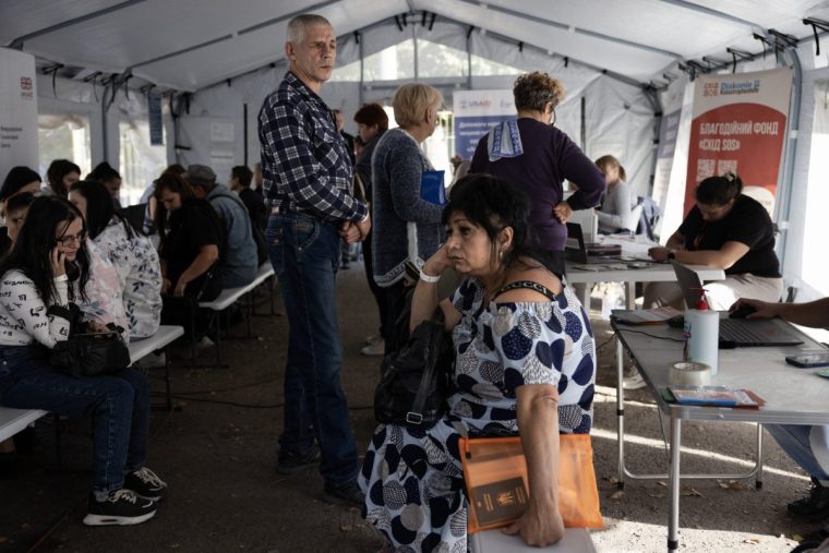 PAVLOHRAD, UKRAINE- OCTOBER 10: Ukrainians wait to register at a refugee center on October,10 2024 in Pavlohrad, Ukraine. Residents of front line areas of Pokrovsk, Myrnohard and Kurakove were forced to flee as the area has been hit by intense Russian bombardment over weeks now, many waiting to leave until the last moment. Pokrovsk has no electricity, gas or water supply and the city is under constant curfews making life unbearable and too dangerous. (Photo by Paula Bronstein/Getty Images)