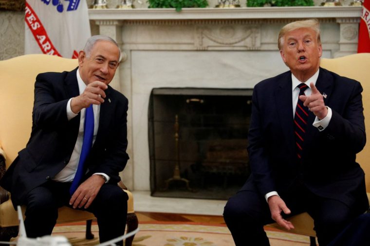 FILE PHOTO: Israel's Prime Minister Benjamin Netanyahu meets with U.S. President Donald Trump prior to signing the Abraham Accords, normalizing relations between Israel and some of its Middle East neighbors in a strategic realignment of Middle Eastern countries against Iran, during a meeting in the Oval Office at the White House in Washington, U.S., September 15, 2020. REUTERS/Tom Brenner/File Photo