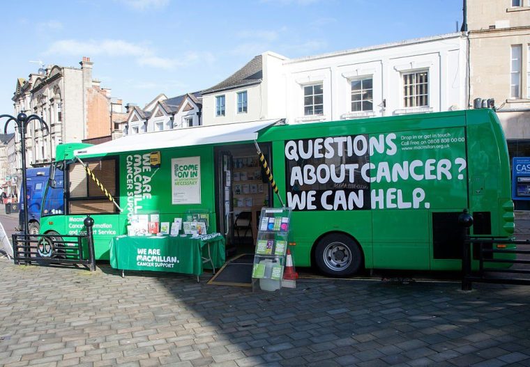 Macmillan Cancer Support green bus in the town centre of Chippenham, Wiltshire, England (Photo by: Education Images/Universal Images Group via Getty Images)