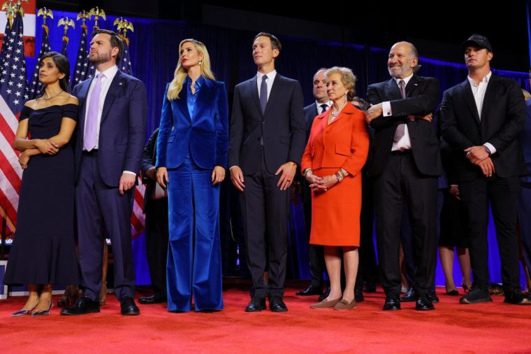 Republican vice presidential nominee JD Vance and his wife Usha, Ivanka Trump and her husband Jared Kushner, Linda McMahon, Howard Lutnick and Bryson Dechambeau listen as Republican presidential nominee former U.S. President Donald Trump speaks at his election night rally at the Palm Beach County Convention Center in West Palm Beach, Florida, U.S., November 6, 2024. REUTERS/Brian Snyder