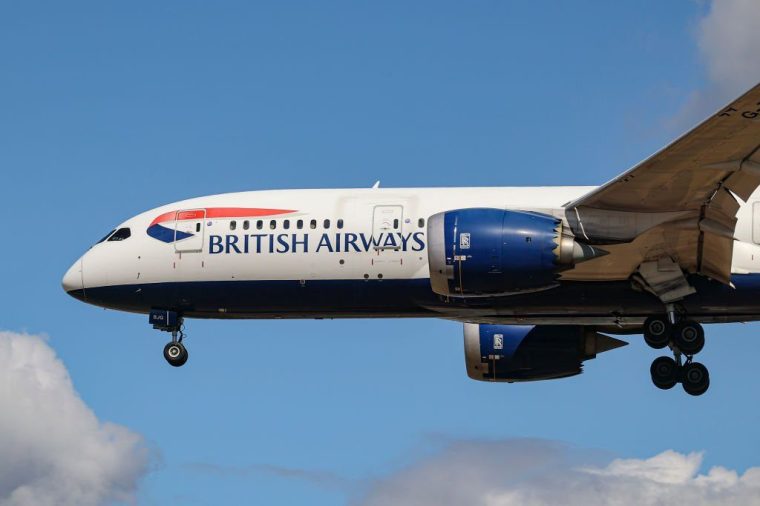 British Airways Boeing 787 Dreamliner aircraft as seen on final approach flying over the houses of Myrtle avenue in London a famous location for plane spotting, for landing at London Heathrow Airport LHR. The modern wide-body B787-8 passenger airplane has the registration G-ZBJG and is powered by 2x RR jet engines.British Airways BAW BA is the flag carrier of the United Kingdom, part of IAG International Airlines Group and member of Oneworld aviation alliance. London, United Kingdom on August 2022 (Photo by Nicolas Economou/NurPhoto via Getty Images)