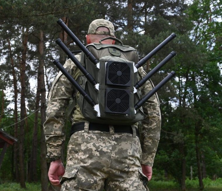 A Ukrainian serviceman tests an anti-drone backpack during a presentation of radio-electronic warfare (WB) and radio-electronic intelligence (PER) systems of the Ukrainian company Kvertus in Lviv region on May 28, 2024, amid the Russian invasion of Ukraine. The event was organized by the charity foundation 'Zavzhdy UA' (Forever Ukraine) with the Ukrainian company Kvertus. (Photo by YURIY DYACHYSHYN / AFP) (Photo by YURIY DYACHYSHYN/AFP via Getty Images)