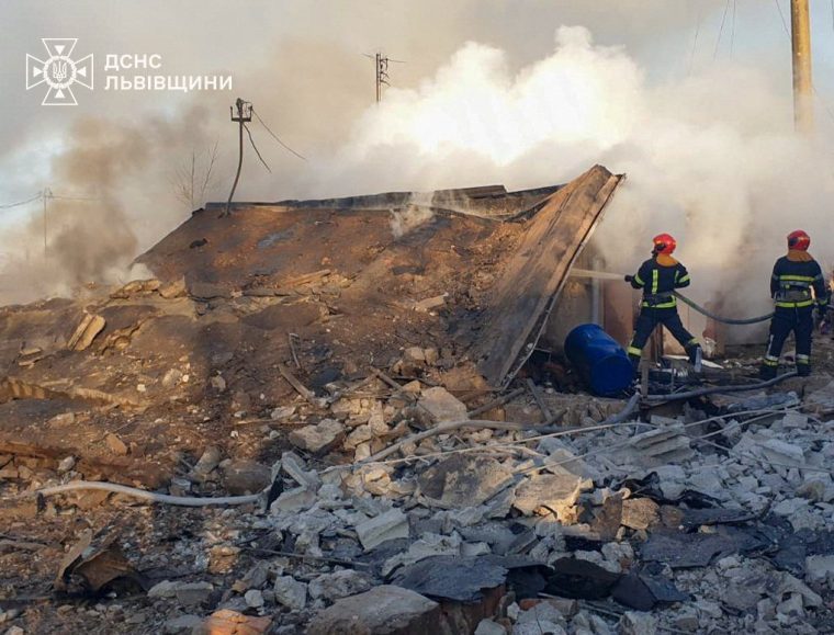 Firefighters work at the site of a residential area hit by a Russian missile strike, amid Russia's attack on Ukraine, in Lviv region, Ukraine November 17, 2024. Press service of the State Emergency Service of Ukraine in Lviv region/Handout via REUTERS ATTENTION EDITORS - THIS IMAGE HAS BEEN SUPPLIED BY A THIRD PARTY. DO NOT OBSCURE LOGO.