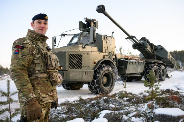 ROVANIEMI, FINLAND - NOVEMBER 20: Lt Col Ben Baldwinson of the 19th Regiment Royal Artillery (The Scottish Gunners) stands for a portrait next to an Archer self-propelled Howitzer during the NATO "Exercise Lightning Strike" on November 20, 2024 near Heinu, Finland. The live-fire exercise includes service members from 28 Allied and partner nations, and is taking place between November 4-24, across locations in Finland, Estonia, Germany, Poland, and Romania. (Photo by Leon Neal/Getty Images)