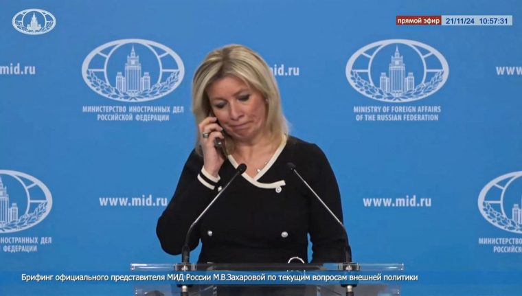 TOPSHOT - A tv grab taken from handout footage released on November 21, 2024 by the Russian Foreign Ministry shows Russia's foreign ministry spokesperson, Maria Zakharova, receiving a phone call during a live press briefing ordering her not to comment on reports of a ballistic missile strike on Ukraine. An unknown male voice on the phone can be heard addressing her: "On the 'Yuzhmash' ballistic missile strike that the Westerners have started talking about, we are not commenting at all," he says, referring to an aerospace manufacturer based in the Ukrainian city of Dnipro. (Photo by RUSSIAN FOREIGN MINISTRY / AFP) / RESTRICTED TO EDITORIAL USE - MANDATORY CREDIT "AFP PHOTO / RUSSIAN FOREIGN MINISTRY" - NO MARKETING NO ADVERTISING CAMPAIGNS - DISTRIBUTED AS A SERVICE TO CLIENTS (Photo by -/RUSSIAN FOREIGN MINISTRY/AFP via Getty Images)