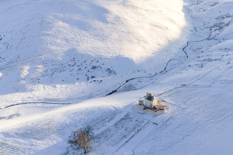 Corgarff Castle in Aberdeenshire, surrounded by snow on Friday. Storm Bert is battering the country with strong winds, heavy rain and snow and ice with amber warnings coming into force bringing a "potential risk to life and property". Picture date: Friday November 22, 2024. PA Photo. Photo credit should read: Jane Barlow/PA Wire