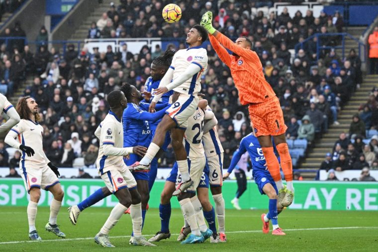 Chelsea's Spanish goalkeeper #01 Robert Sanchez (R) punches the ball clear during the English Premier League football match between Leicester City and Chelsea at King Power Stadium in Leicester, central England on November 23, 2024. (Photo by JUSTIN TALLIS / AFP) / RESTRICTED TO EDITORIAL USE. No use with unauthorized audio, video, data, fixture lists, club/league logos or 'live' services. Online in-match use limited to 120 images. An additional 40 images may be used in extra time. No video emulation. Social media in-match use limited to 120 images. An additional 40 images may be used in extra time. No use in betting publications, games or single club/league/player publications. / (Photo by JUSTIN TALLIS/AFP via Getty Images)