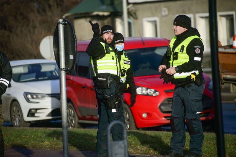 VILNIUS, LITHUANIA - NOVEMBER 25: Officers take security measures after a DHL cargo plane, which took off from Leipzig, crashed into a two-story residential building near Vilnius Airport in Lithuania early Monday, killing one crew member and injuring four others on November 25, 2024. Authorities have launched an investigation into the cause of the crash. It marks another troubling incident for DHL, which has faced operational disruptions this year. (Photo by Yauhen Yerchak/Anadolu via Getty Images)