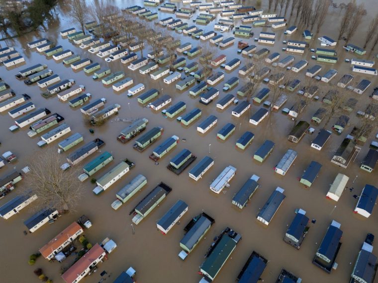 A drone view shows static caravans surrounded by floodwater after the River Nene burst its banks at Billing Aquadrome near Northampton, Britain, November 25, 2024. REUTERS/Phil Noble