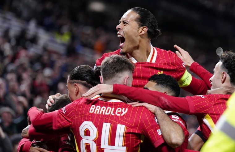 Liverpool's Virgil van Dijk (top) celebrates after his team mate Alexis Mac Allister (obscured) scored the first goal of the game during the UEFA Champions League, league stage match at Anfield, Liverpool. Picture date: Wednesday November 27, 2024. PA Photo. See PA story SOCCER Liverpool. Photo credit should read: Peter Byrne/PA Wire. RESTRICTIONS: Use subject to restrictions. Editorial use only, no commercial use without prior consent from rights holder.