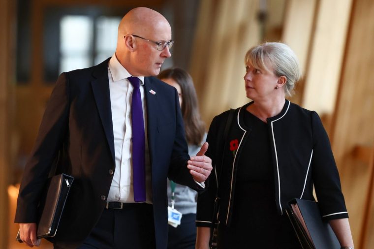 EDINBURGH, SCOTLAND - OCTOBER 30: First Minister John Swinney and Shona Robison Cabinet Secretary for Finance and Local Government arrive for a motion of condolence for former First Minister Alex Salmond at the Scottish Parliament on October 30, 2024 in Edinburgh, Scotland. A private funeral service was held for Mr. Salmond on Tuesday, following his death on October 12. The Former First Minister of Scotland suffered a heart attack and died suddenly, during a conference he was attending in North Macedonia. Salmond served as First Minister of Scotland from 2007 to 2014. (Photo by Jeff J Mitchell/Getty Images)