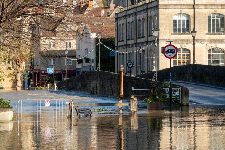 BRADFORD ON AVON, ENGLAND - NOVEMBER 25: Flood water surrounds the town bridge which spans the River Avon which has burst its banks and flooded nearby riverside properties on November 25, 2024 in Bradford on Avon, England. Parts of England and Wales saw flooding as Storm Bert swept across the UK over the weekend. (Photo by Anna Barclay/Getty Images)