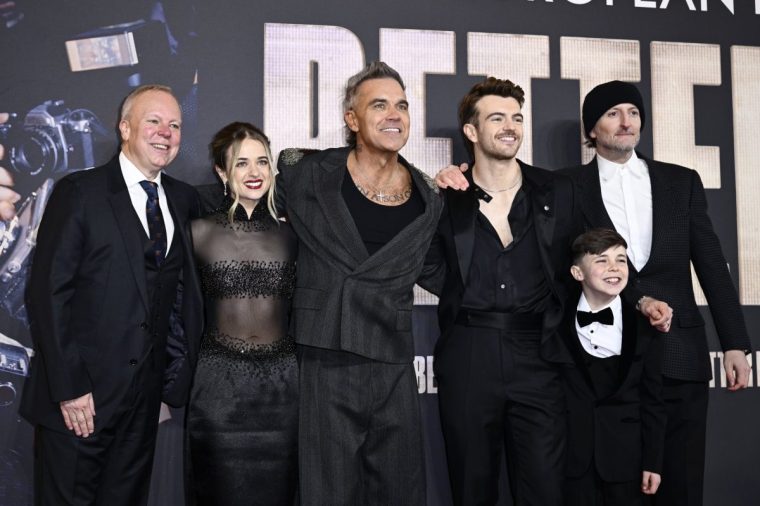 LONDON, ENGLAND - NOVEMBER 27: Steve Pemberton, Raechelle Banno, Robbie Williams, Jonno Davies, Carter J Murphy and Michael Gracey attend the "Better Man" European Premiere at the Odeon Luxe Leicester Square on November 27, 2024 in London, England. (Photo by Gareth Cattermole/Getty Images)