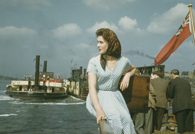 A young woman poses by the sea at Southend, Essex, July 1953. Original publication: Picture Post - 6611 - Southend River Trip - pub. 1st August 1953. (Photo by Bert Hardy/Picture Post/Hulton Archive/Getty Images)