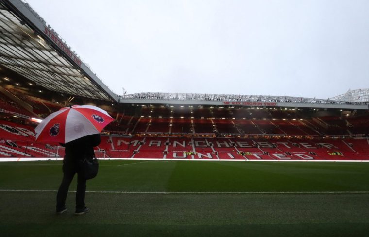 Soccer Football - Premier League - Manchester United v Nottingham Forest - Old Trafford, Manchester, Britain - December 7, 2024 General view of a person holding an umbrella during storm Darragh inside the stadium before the match REUTERS/Scott Heppell EDITORIAL USE ONLY. NO USE WITH UNAUTHORIZED AUDIO, VIDEO, DATA, FIXTURE LISTS, CLUB/LEAGUE LOGOS OR 'LIVE' SERVICES. ONLINE IN-MATCH USE LIMITED TO 120 IMAGES, NO VIDEO EMULATION. NO USE IN BETTING, GAMES OR SINGLE CLUB/LEAGUE/PLAYER PUBLICATIONS. PLEASE CONTACT YOUR ACCOUNT REPRESENTATIVE FOR FURTHER DETAILS..