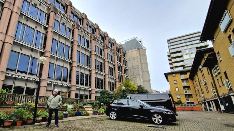 This small car park is all that would separate China's new embassy complex, replacing the building seen here on the left, from the housing estate where Dave Lake lives, on the right (Photo: Rob Hastings)