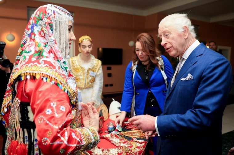 Britain's King Charles III speaks with a guest during a reception at Waltham Forest Town Hall in London on December 20, 2024, to meet local community volunteers, young people, emergency services, and faith representatives operating in Waltham Forest. (Photo by Mina Kim / POOL / AFP) (Photo by MINA KIM/POOL/AFP via Getty Images)