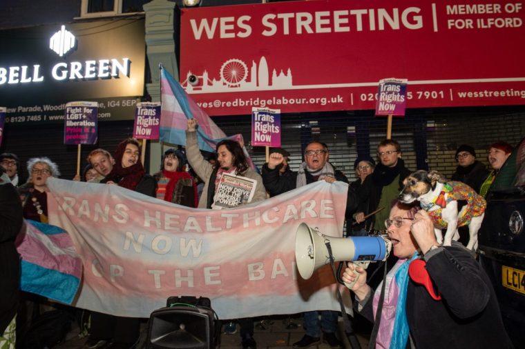 LONDON, ENGLAND - DECEMBER 16: Activists protest outside the constituency office of health secretary Wes Streeting on December 16, 2024 in London, United Kingdom. Last week Health Secretary Wes Streeting announced he would indefinitely ban puberty blocking drugs for people under age eighteen, after experts found that prescribing the drugs was an "unacceptable safety risk." Puberty blockers are drugs administered to young people experiencing gender dysphoria, to prevent them from undergoing puberty. (Photo by Guy Smallman/Getty Images)