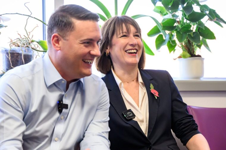 LONDON, ENGLAND - OCTOBER 28: Chancellor of the Exchequer Rachel Reeves (R) and Health Secretary Wes Streeting (L) speak with members of staff as they visit St. George's Hospital, on October 28, 2024 in London, England. Reeves and Streeting are visiting St. George's Hospital ahead of the Autumn budget on Wednesday. The Budget will be the first delivered by Reeves and the new Labour government. (Photo by Leon Neal/Getty Images)