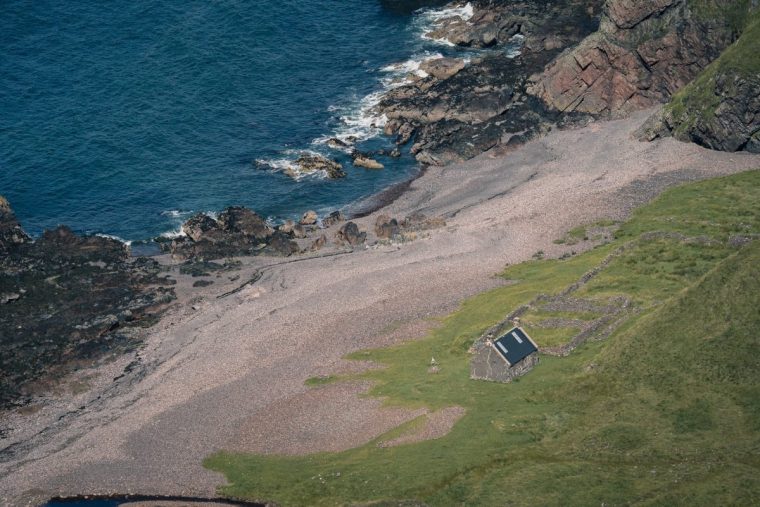 SCOTLAND, August 2019: The Guirdil bothy at the western coastline of the Isle of Rum, a small island at the West Coast of Scotland (Scottish Highlands).