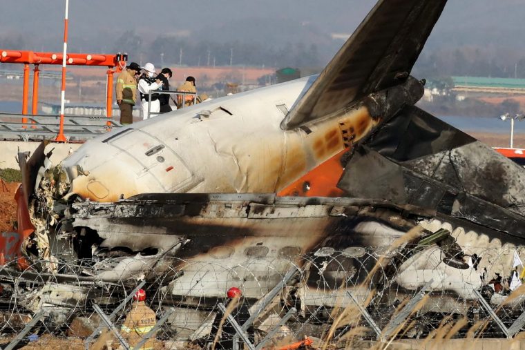 MUAN-GUN, SOUTH KOREA - DECEMBER 29: Firefighters and rescue teams work at the wreckage of a passenger plane at Muan International Airport on December 29, 2024 in Muan-gun, South Korea. A plane carrying 181 people, Jeju Air Flight 7C2216, crashed at Muan International Airport in South Korea after skidding off the runway and colliding with a wall, resulting in an explosion. Latest reports said that at least 179 people had died. (Photo by Chung Sung-Jun/Getty Images)