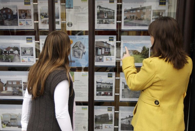 An estate agents window display is pictured in Epping in Essex, in south-east England on October 14, 2008. British estate agents are selling less than one property a week as a lack of mortgage finance hits the number of people moving house, fueling plummeting prices, a surveyors' body said Tuesday. AFP PHOTO/Shaun Curry (Photo credit should read SHAUN CURRY/AFP via Getty Images)