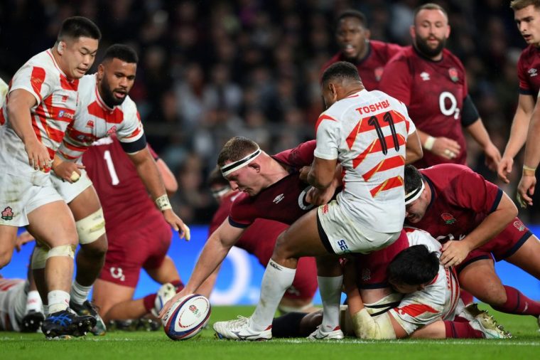 LONDON, ENGLAND - NOVEMBER 24: Sam Underhill of England scores his team's second try despite the challenge of Jone Naikabula of Japanduring the Autumn Nations Series 2024 match between England and Japan at Allianz Stadium on November 24, 2024 in London, England. (Photo by Patrick Khachfe/Getty Images)