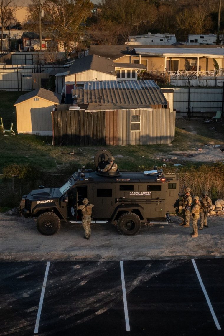 A drone view shows the Federal Bureau of Investigation (FBI) and Harris County law enforcement officials as they surround a residence in an armored vehicle in north Houston, Texas, U.S., January 1, 2025. In a social media post, the FBI stated the activity in North Houston is "related to this morning's New Orleans attack" and asked residents to avoid the area. REUTERS/Adrees Latif