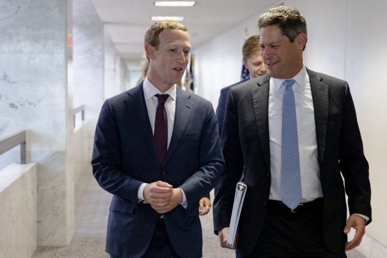 WASHINGTON, DC - SEPTEMBER 19: Facebook founder and CEO Mark Zuckerberg (L) and Facebook's Vice President of Global Public Policy, Joel Kaplan (R) chat after leaving a meeting with Senator John Cornyn (R-TX) in his office on Capitol Hill on September 19, 2019 in Washington, DC. Zuckerberg is making the rounds with various lawmakers in Washington today. (Photo by Samuel Corum/Getty Images)