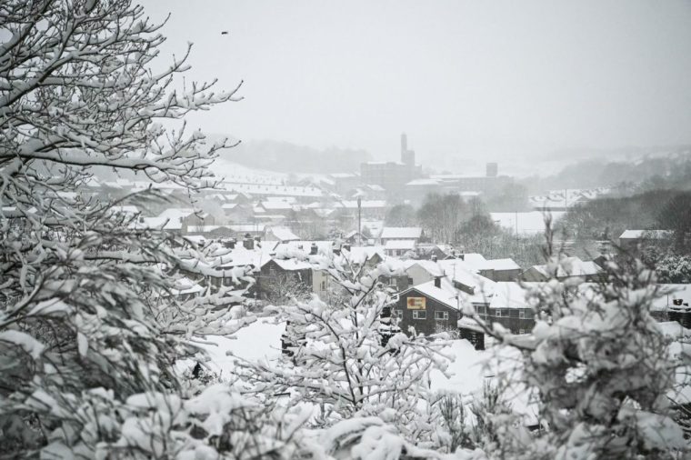 A photograph taken on January 5, 2025 shows the Marsden, northern England, covered in snow as heavy snow across parts of England are set to cause disruption. An amber weather warning -- the second most serious -- for snow and freezing rain was in place for much of Wales, central England and parts of northwestern England. (Photo by Oli SCARFF / AFP) (Photo by OLI SCARFF/AFP via Getty Images)