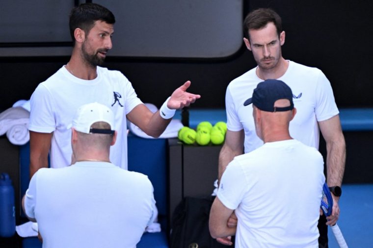 Novak Djokovic of Serbia (top L) talks with coach Andy Murray (top R) during a training session ahead of the Australian Open tennis tournament in Melbourne on January 7, 2025. (Photo by William WEST / AFP) / --IMAGE RESTRICTED TO EDITORIAL USE - STRICTLY NO COMMERCIAL USE-- (Photo by WILLIAM WEST/AFP via Getty Images)