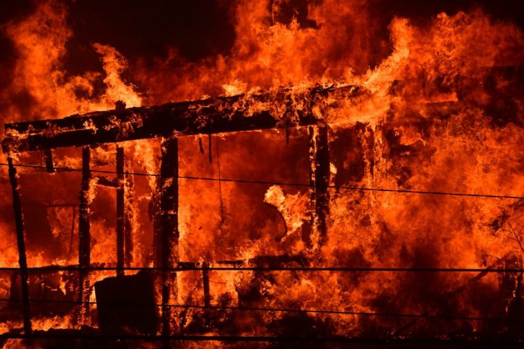 A house is engulfed in flames from the wind-driven Palisades Fire in Pacific Palisades, California, January 7, 2025. A ferocious wildfire in a Los Angeles suburb devoured buildings and sparked panicked evacuations January 7, as hurricane-force winds tore through the region. More than 200 acres (80 hectares) was burning in Pacific Palisades, a upscale spot with multi-million dollar homes in the Santa Monica Mountains, shuttering a key highway and blanketing the area with thick smoke. Around 30,000 people were ordered to evacuate the fast-spreading flames, which leveled multiple homes as powerful winds spread embers far and wide. (Photo by Robyn Beck / AFP) (Photo by ROBYN BECK/AFP via Getty Images)