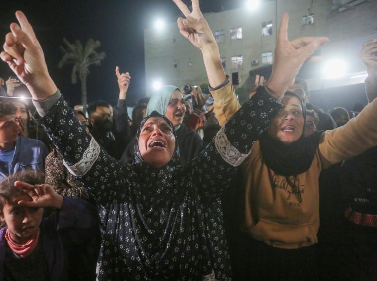 GAZA CITY, GAZA - JANUARY 15: Palestinians gather to celebrate after US President-elect Donald Trump's announcement of hostage deal, on January 15, 2025 in Deir al-Balah, Gaza. Trump on Wednesday announced a deal has been reached for hostages in Gaza amid reports that Israel and Hamas agreed to a cease-fire deal. (Photo by Ashraf Amra/Anadolu via Getty Images)