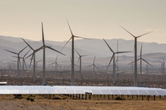 An array of electricity producing wind turbines are viewed along Interstate 10 on May 11, 2022 near Palm Springs, California. Credit: George Rose/Getty Images