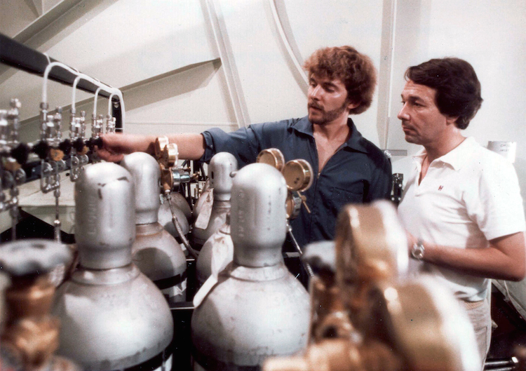 Exxon's Richard Werthamer (right) and Edward Garvey (left) are aboard the company's Esso Atlantic tanker working on a project to measure the carbon dioxide levels in the ocean and atmosphere. The project ran from 1979 to 1982. Credit: Courtesy of Richard Werthamer